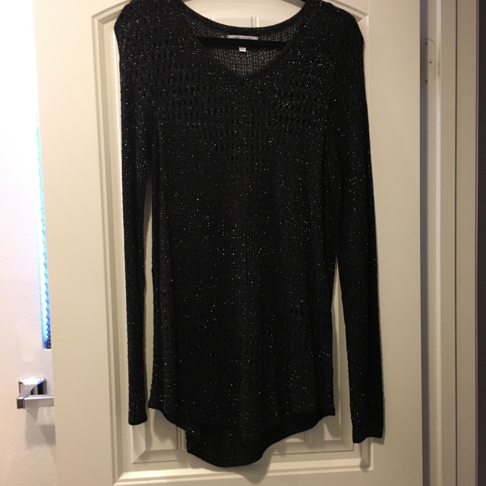 Jennifer Lopez black sweater with gold accent